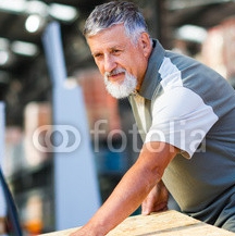 Senior_man_buying_construction_wood_in_a__DIY_store.jpg
